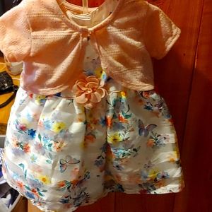 Three dresses girls size 6 to 9 months and 0 to 3 months